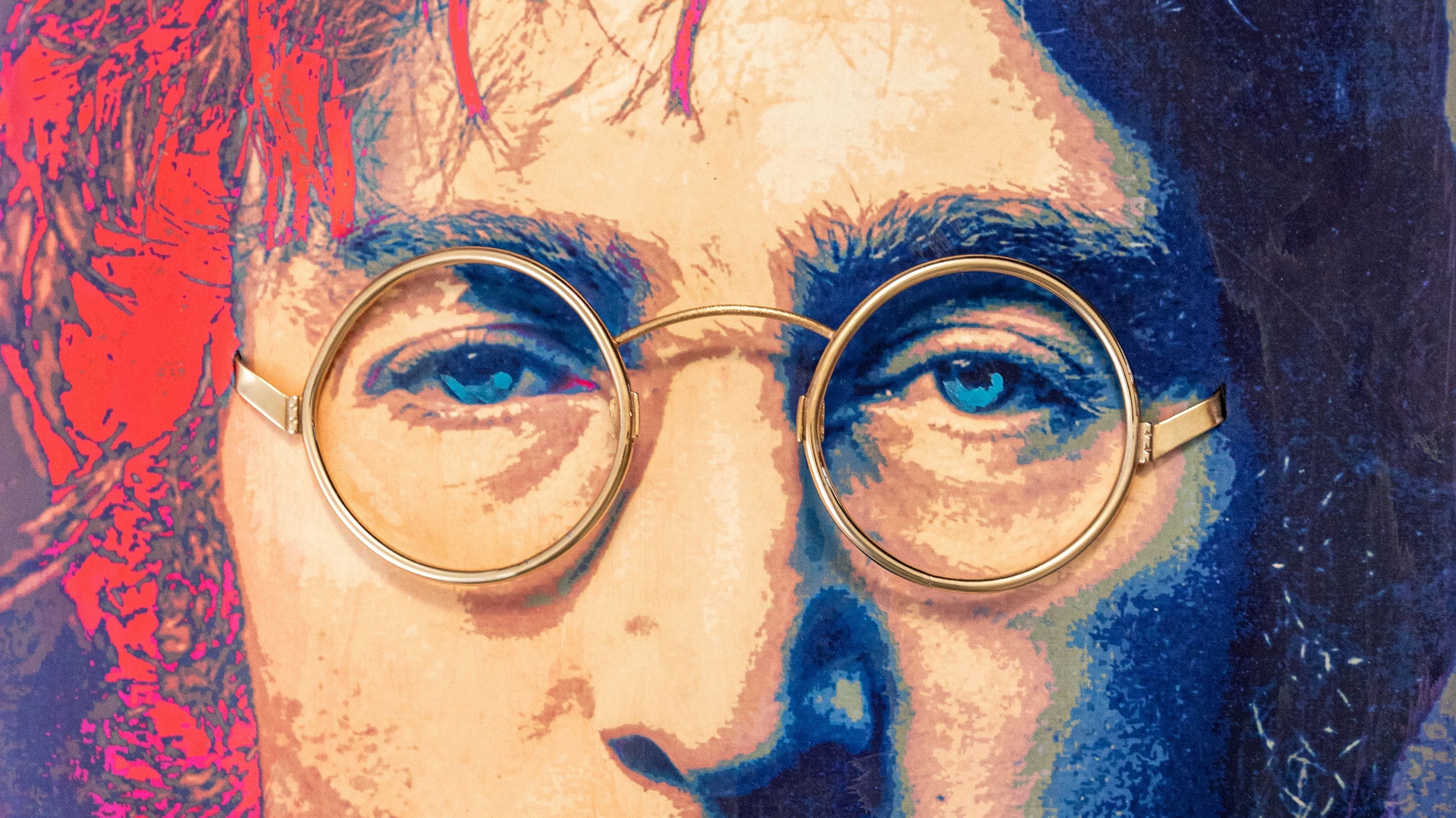 ChatGPT said: Close-up pop art portrait of John Lennon with real gold-plated glasses creating a 3D effect.