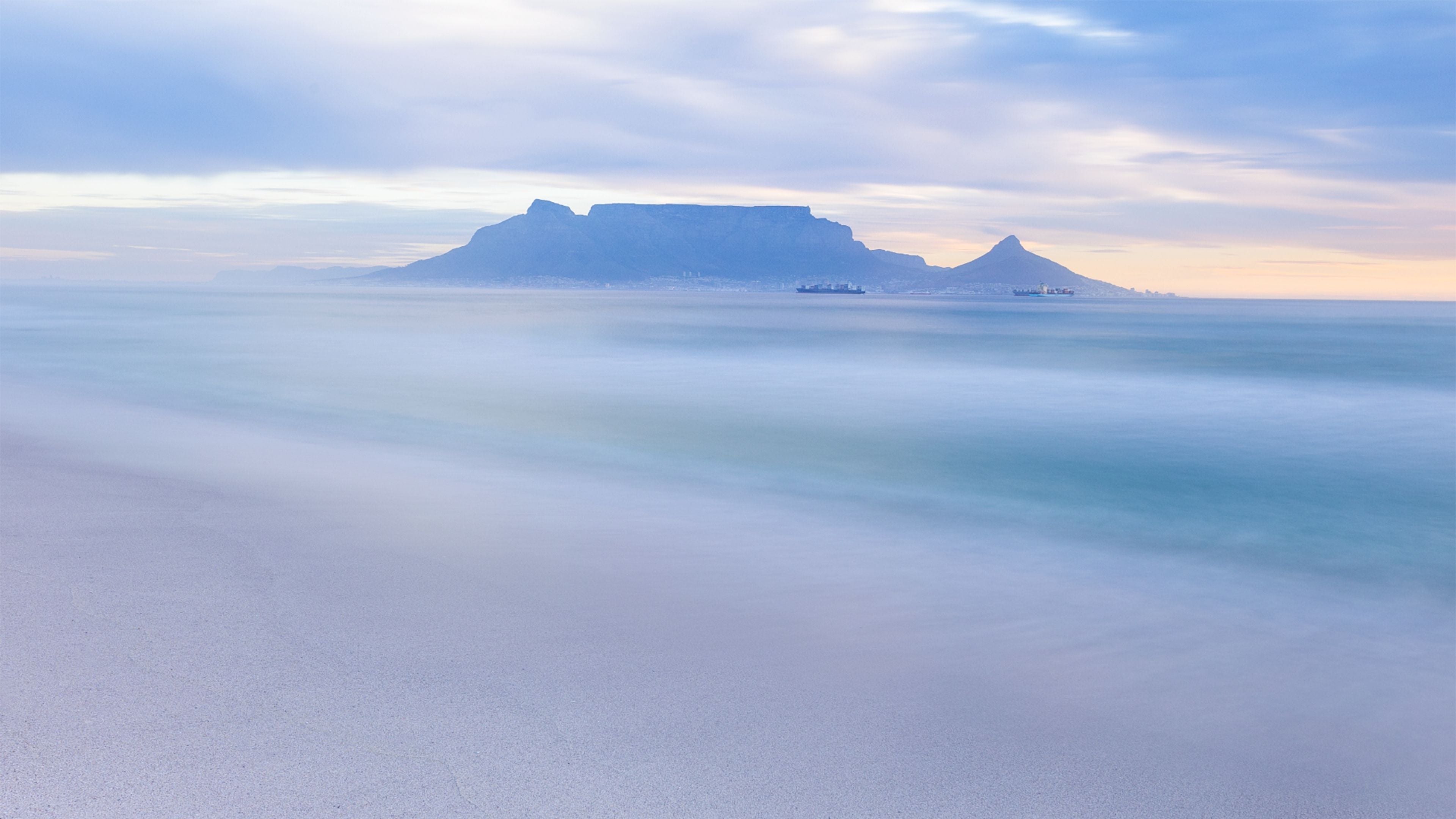 Soft pastel seascape of Table Mountain and Lion’s Head viewed from Blouberg Beach, Cape Town – fine art coastal landscape photograph