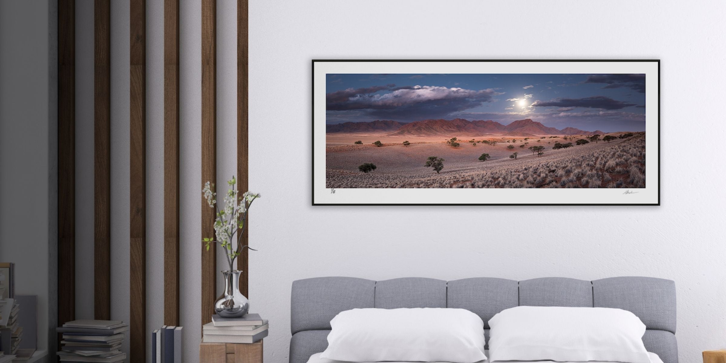 Fine art panoramic photograph by Hougaard Malan showing Wolwedans in Namibia’s NamibRand Desert, with moonlit sky over sweeping dunes and plains